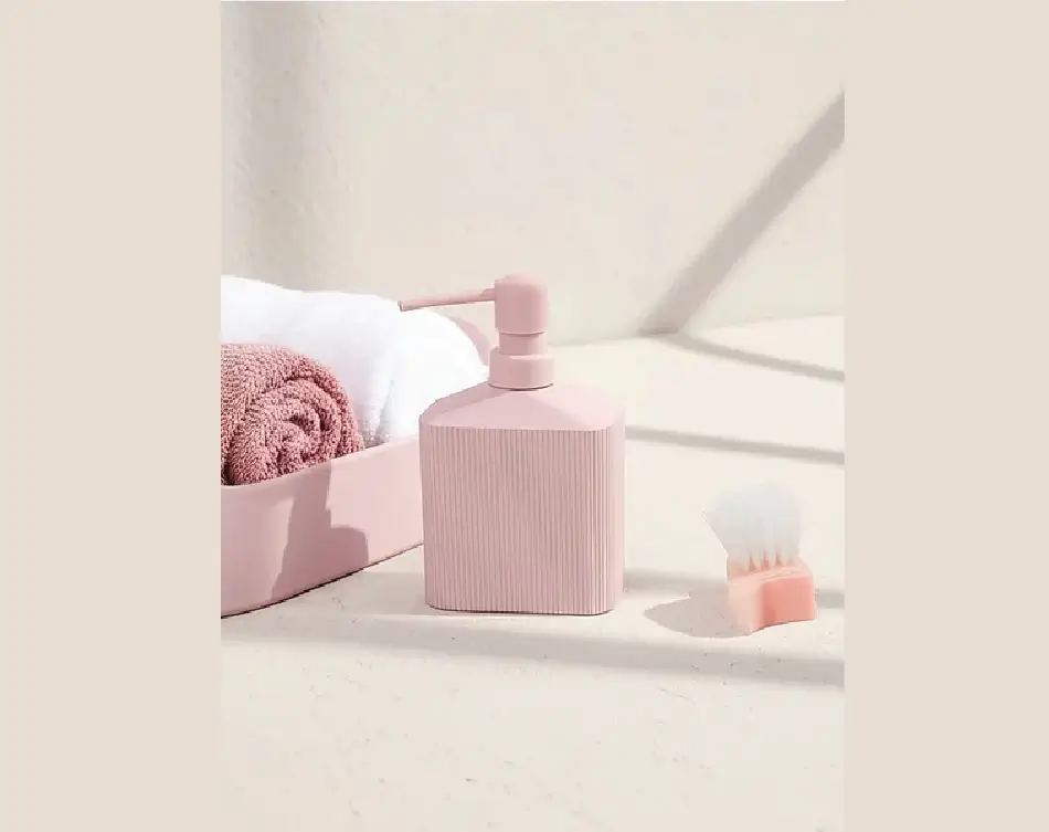 Pink black lotion dispenser ribbed