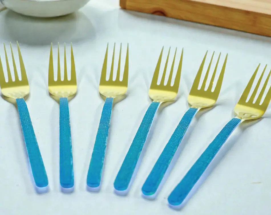 Blue and gold cutlery forks with textured handle